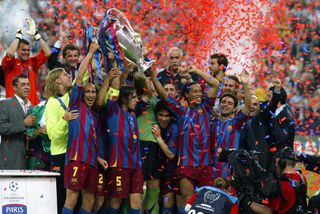 PARIS, FRANCE - May 17: Carles Puyol, Ronaldinho, Giovanni van Bronckhorst and Henrik Larsson of Barcelona lift the European Cup after winning the UEFA Champions League Final match between Barcelona and Arsenal at Stade De France on May 17, 2006 in Paris, France. (Photo by Mike Mayhew/Sportsphoto/Allstar via Getty Images)