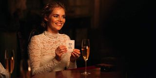 Samara Weaving with hide and seek card in Ready or Not