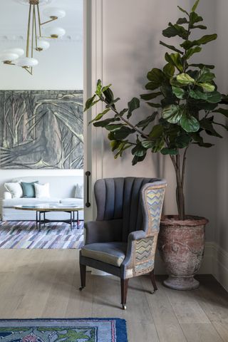 Large canvas, blue armchair and rug