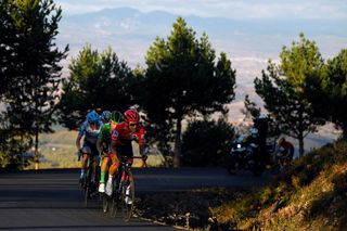 Vuelta a España stage 8: as autumn evening shadows gather, race leader Richard Carapaz leads Roglič en route to the Moncalvillo summit finish