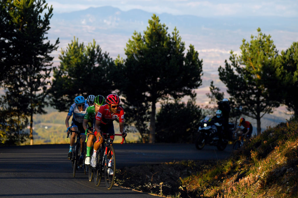 Vuelta a España stage 8: as autumn evening shadows gather, race leader Richard Carapaz leads Roglič en route to the Moncalvillo summit finish