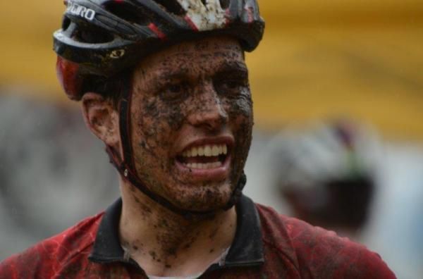 Swiss rider Thomas Zahnd covered in mud.