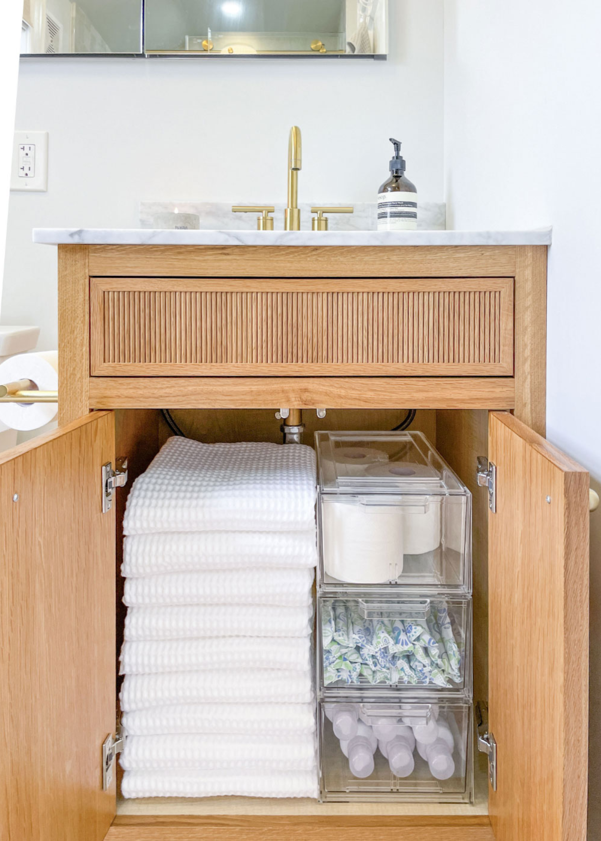 storage boxes in a bathroom cabinet