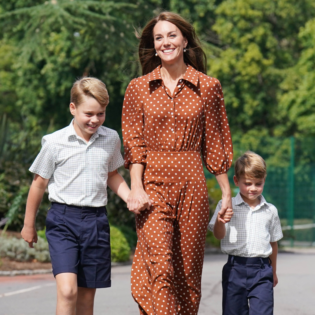 Princess Kate holding hands with Prince George and Prince Louis, wearing school uniforms