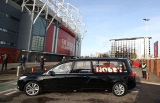 The hearse made its way past Old Trafford before the service at Manchester Crematorium Southern Cemetery