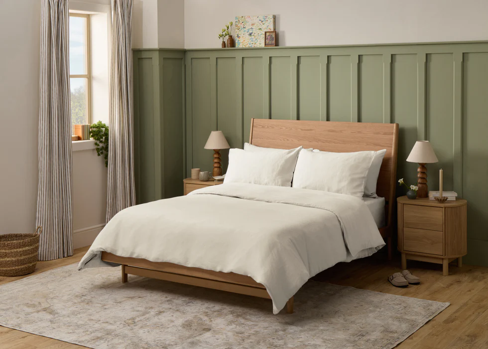 A press shot of the Simba Cool Linen bedding on a beautifully styled bed in a calm-looking bedroom.