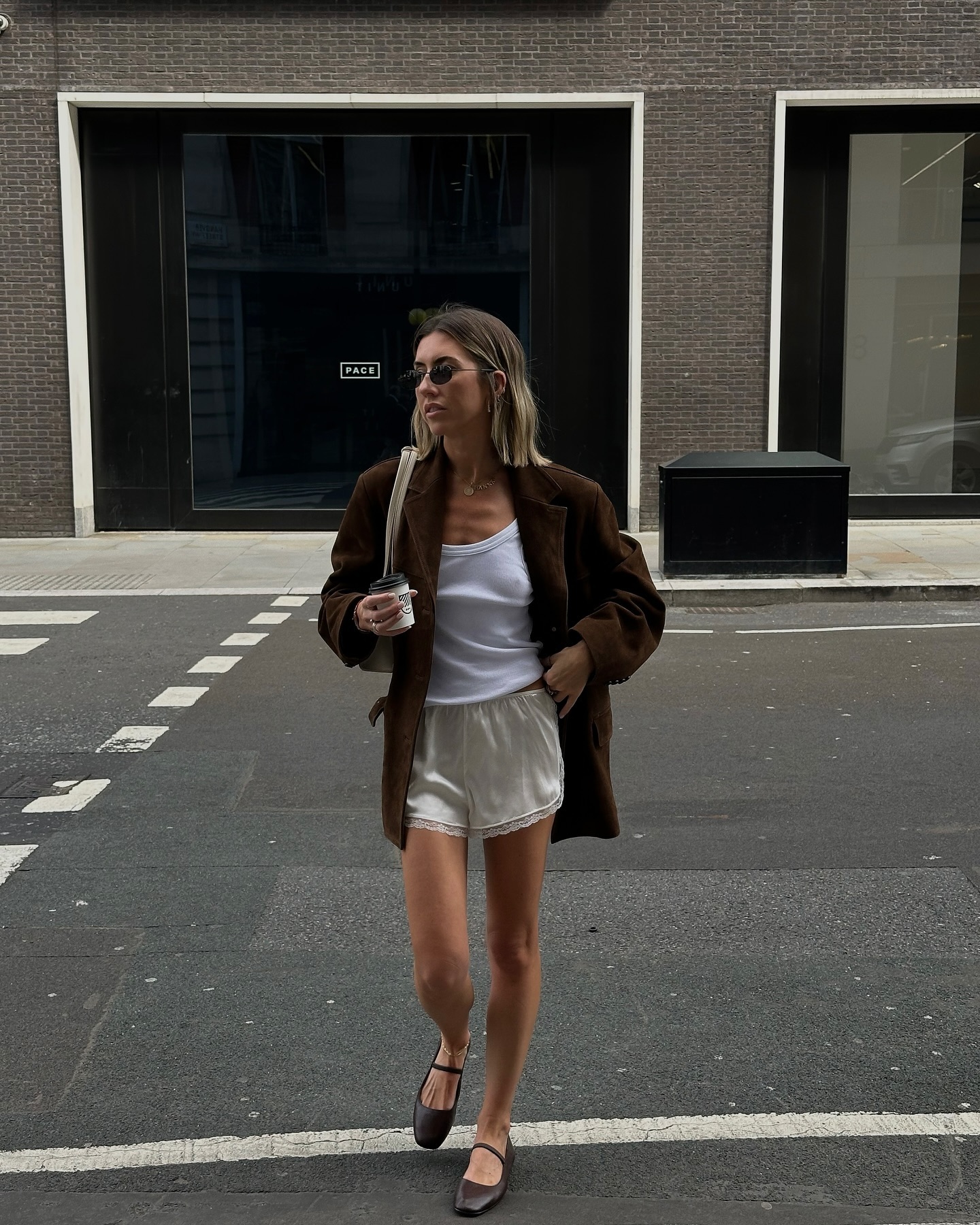 Influencer wears satin shorts.