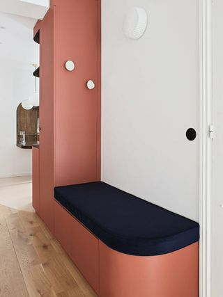 An entryway with a storage bench