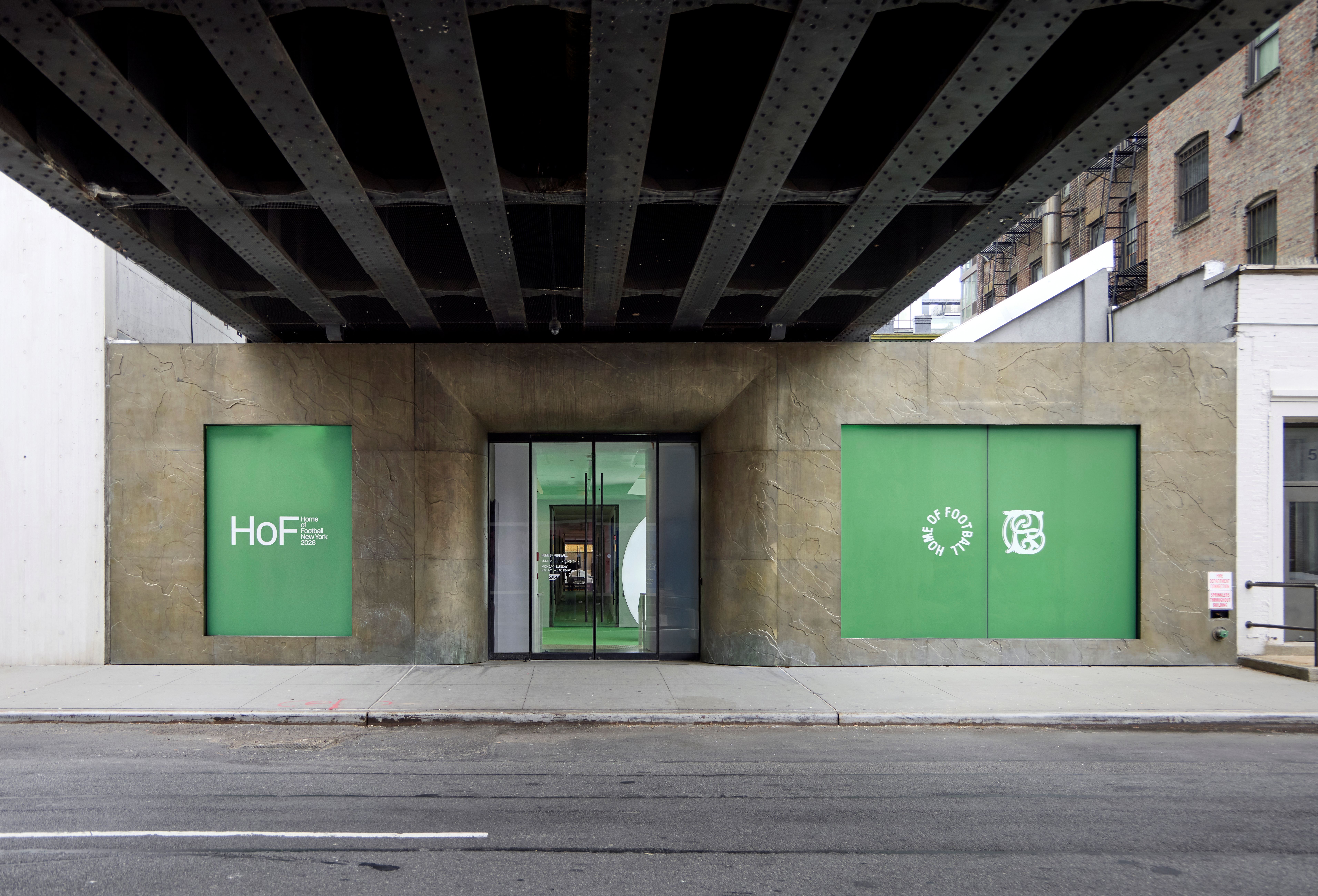 Exterior of Home of Football: Home &amp;amp; Away exhibition space in New York, with green football pitch-inspired doors