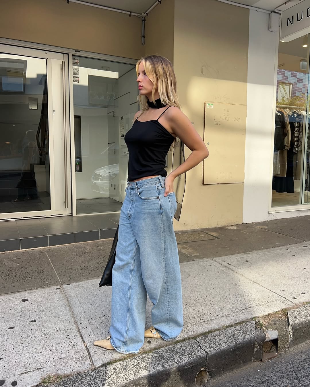 woman wearing neutral color pointed toe shoe trend 2025
