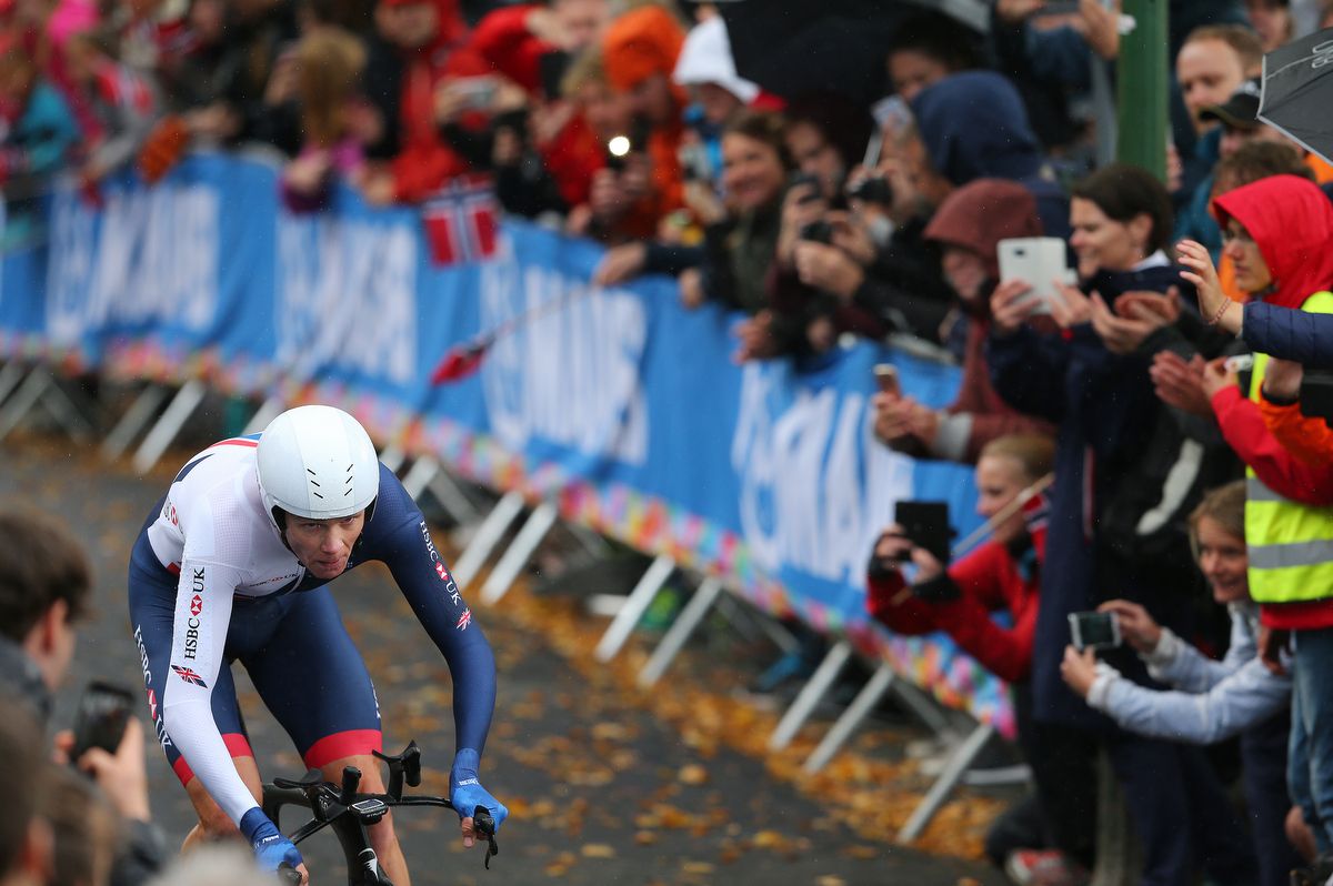 The crowd cheers on Chris Froome (Great Britain)