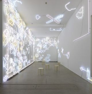 Installation of sign-lights against a wall
