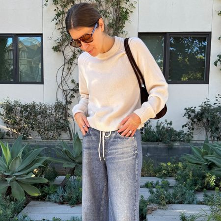 Fashion editor, Judith Jones wearing Rag & Bone's viral Miramar sweatpant jeans and a white sweater