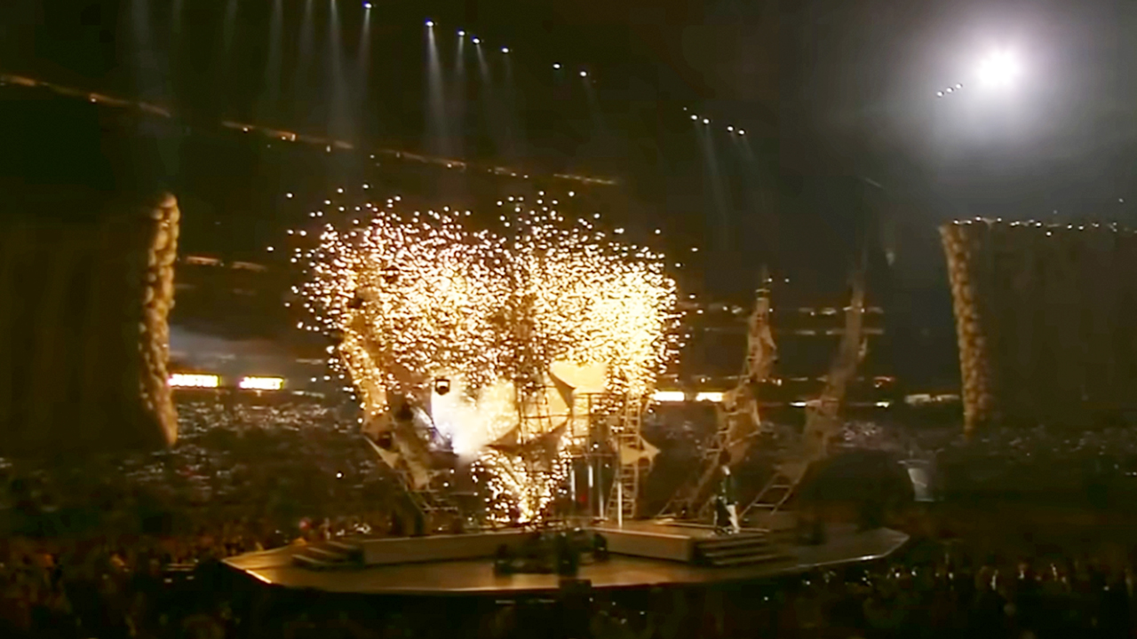 A wideshot of the Super Bowl halftime stage with fireworks going off in 2004. 