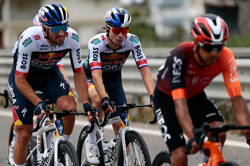 Red Bull-Bora-Hansgrohe's Slovenian rider Primoz Roglic (C) and Red Bull-Bora-Hansgrohe's Italian rider Gianni Moscon (L) ride with the pack during the first stage of the 108th Giro d'Italia cycling race, 160km from Durres to Tirana in Albania, on May 9, 2025. (Photo by Luca Bettini / AFP)