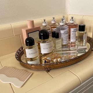 Perfumes on a mirrored vanity tray