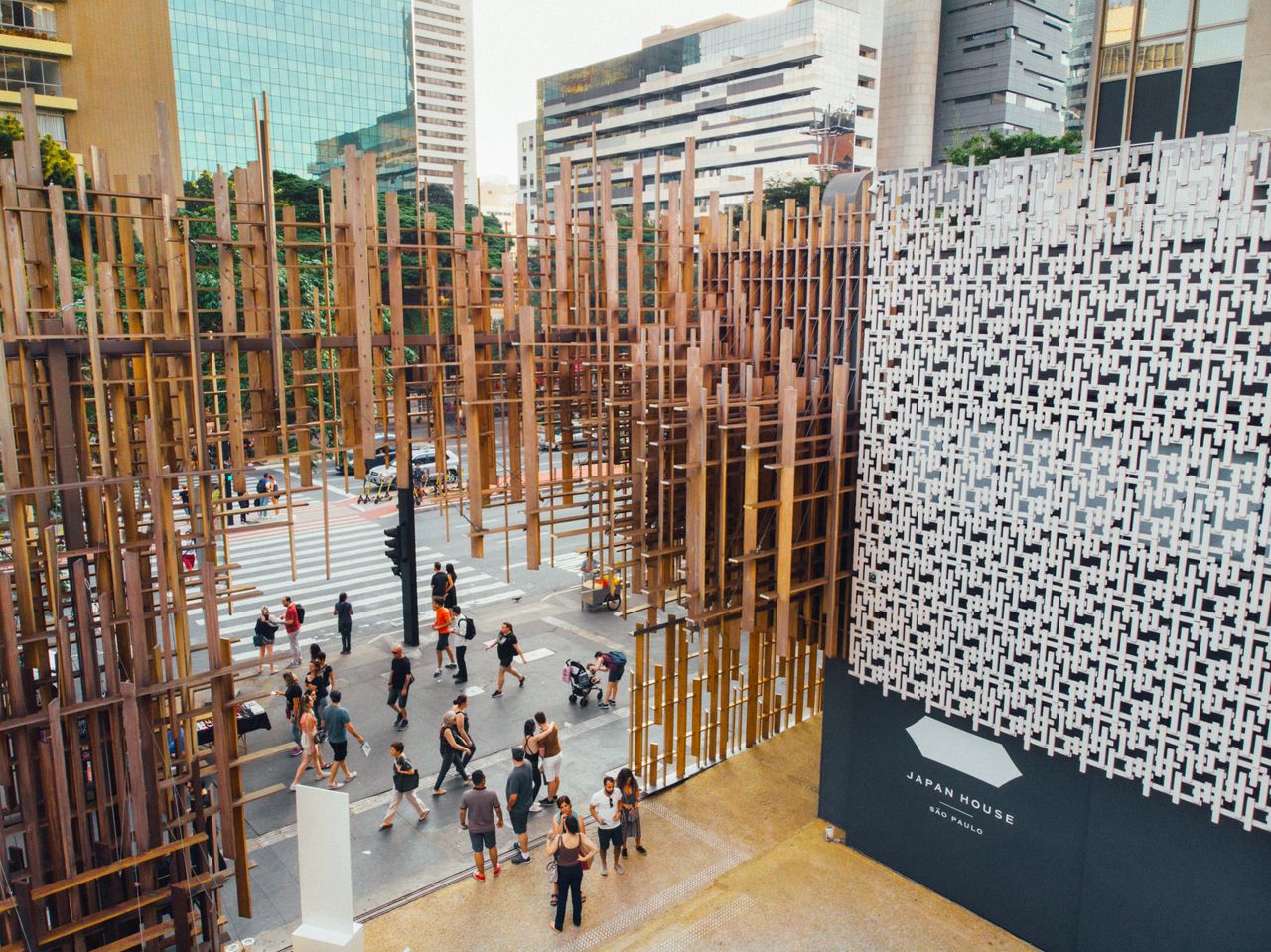 A sophisticatedly decorated museum boasts a wooden facade of interlaced cuts and a stylish, minimalist library.