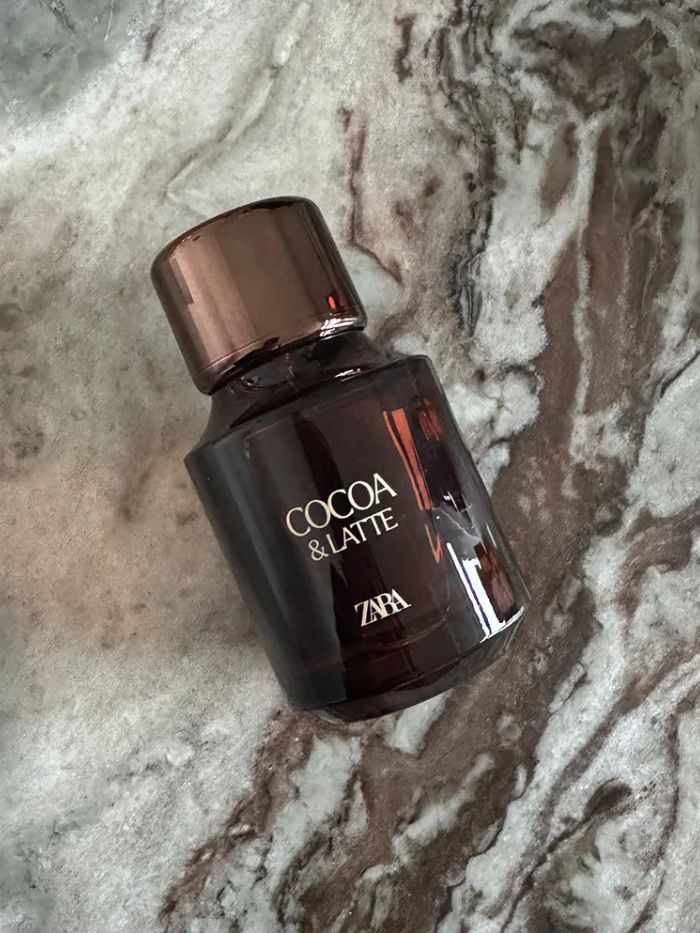 Zara Cocoa &amp;amp; Latte perfume on a marble background