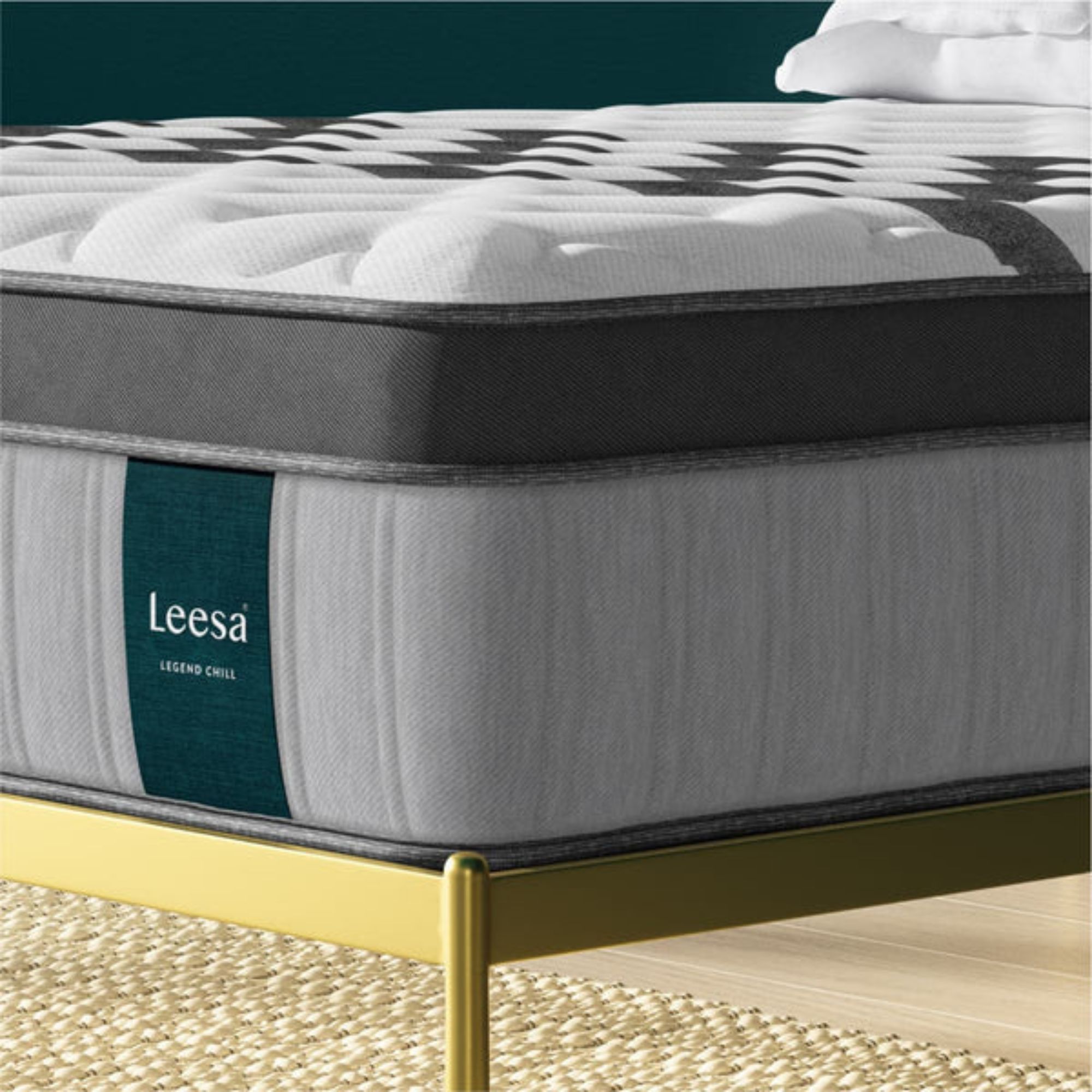 Corner of the Leesa Legend Chill Hybrid Mattress on a bed frame.