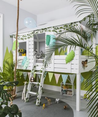 White tree house style bunk bed design with palm trees and bunting by Noa and Nani