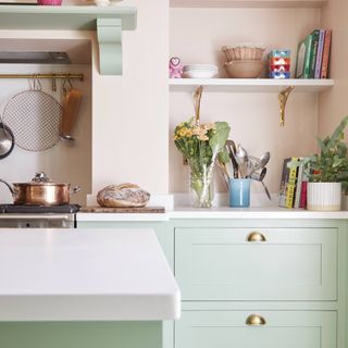 sage green kitchen with pink walls