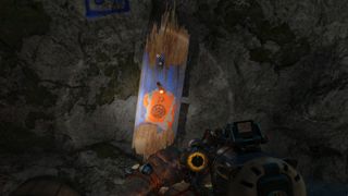 One of many Far Cry 6 Criptograma chest locations, with a coin nailed to a board