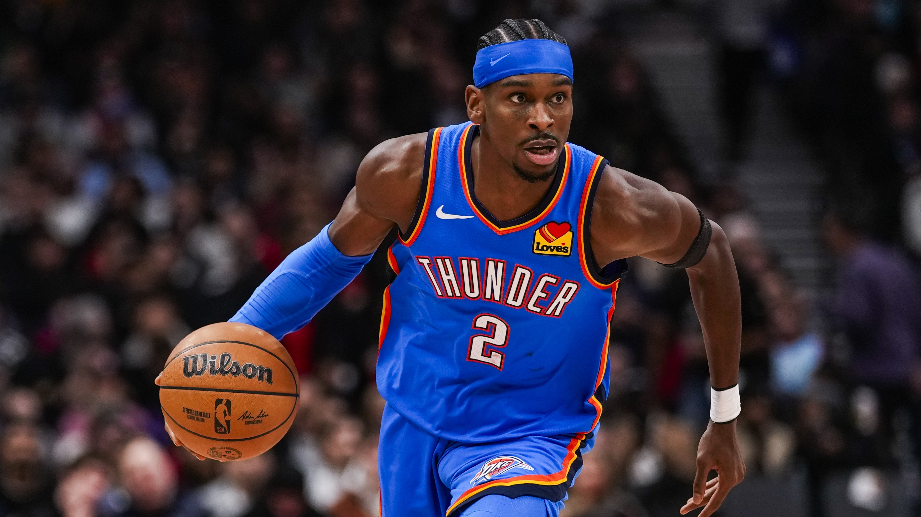 Shai Gilgeous-Alexander #2 of the Oklahoma City Thunder dribbles up the court against the Toronto Raptors at Scotiabank Arena on December 5, 2024 in Toronto, Ontario, Canada. 