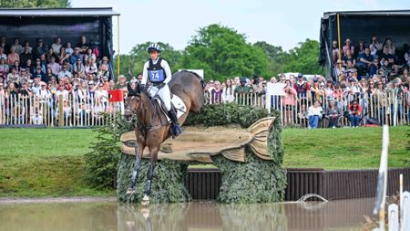 Caroline Powell and Greenacres Special Cavalier jump a cross-country fence into The Lake at Badminton 2026.