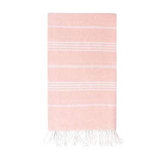 A pale pink and white striped beach towel