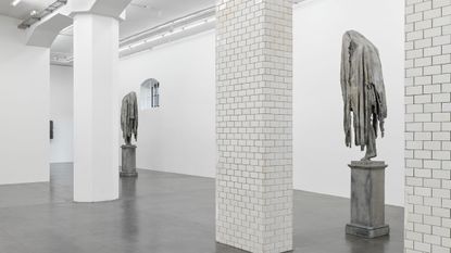 two sculptures of human figures with blankets over their headsview of sculptures at hauser & wirth for berlinde de bruyckeres show 