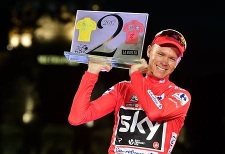 Chris Froome celebrates on the podium after winning the 72nd edition of the Vuelta a Espana in 2017.