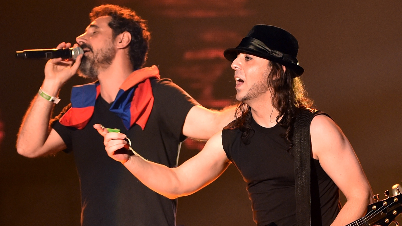 Serj Tankian and Daron Malakian of System Of A Down onstage in 2014