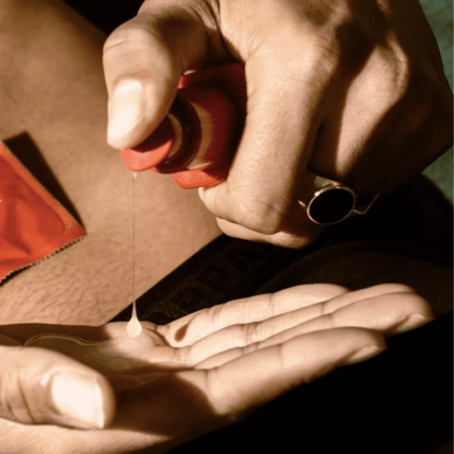 Roam anal lube being squirted onto a hand