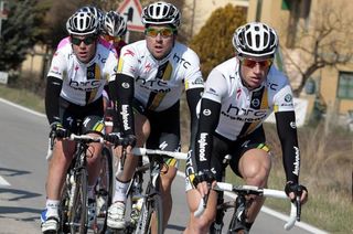 Mark Renshaw and Bernard Eisel try to bring Mark Cavendish back to the front after the climb.