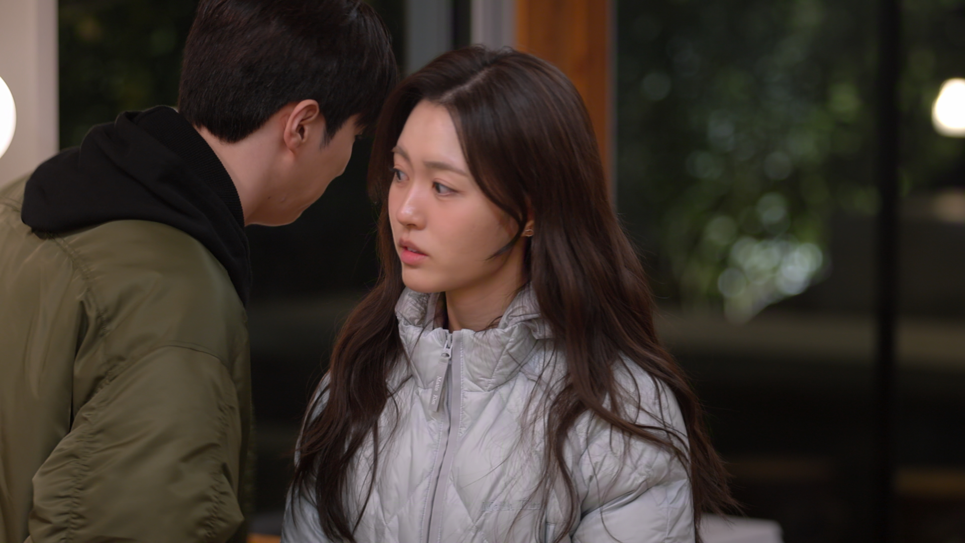Choi Hyun-seo stands close to a man in a green jacket, in Netflix's Korean reality show 'Better Late Than Single.'