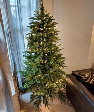 christmas tree decorated with lights using the horizontal lighting method