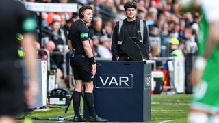 Referee Matthew MacDermid speaks to a Hawk-Eye representative as there is a break in play as VAR is non-operational during a William Hill Premiership match between St Mirren and Hibernian at the SMiSA Stadium, on August 04, 2024, in Paisley, Scotland