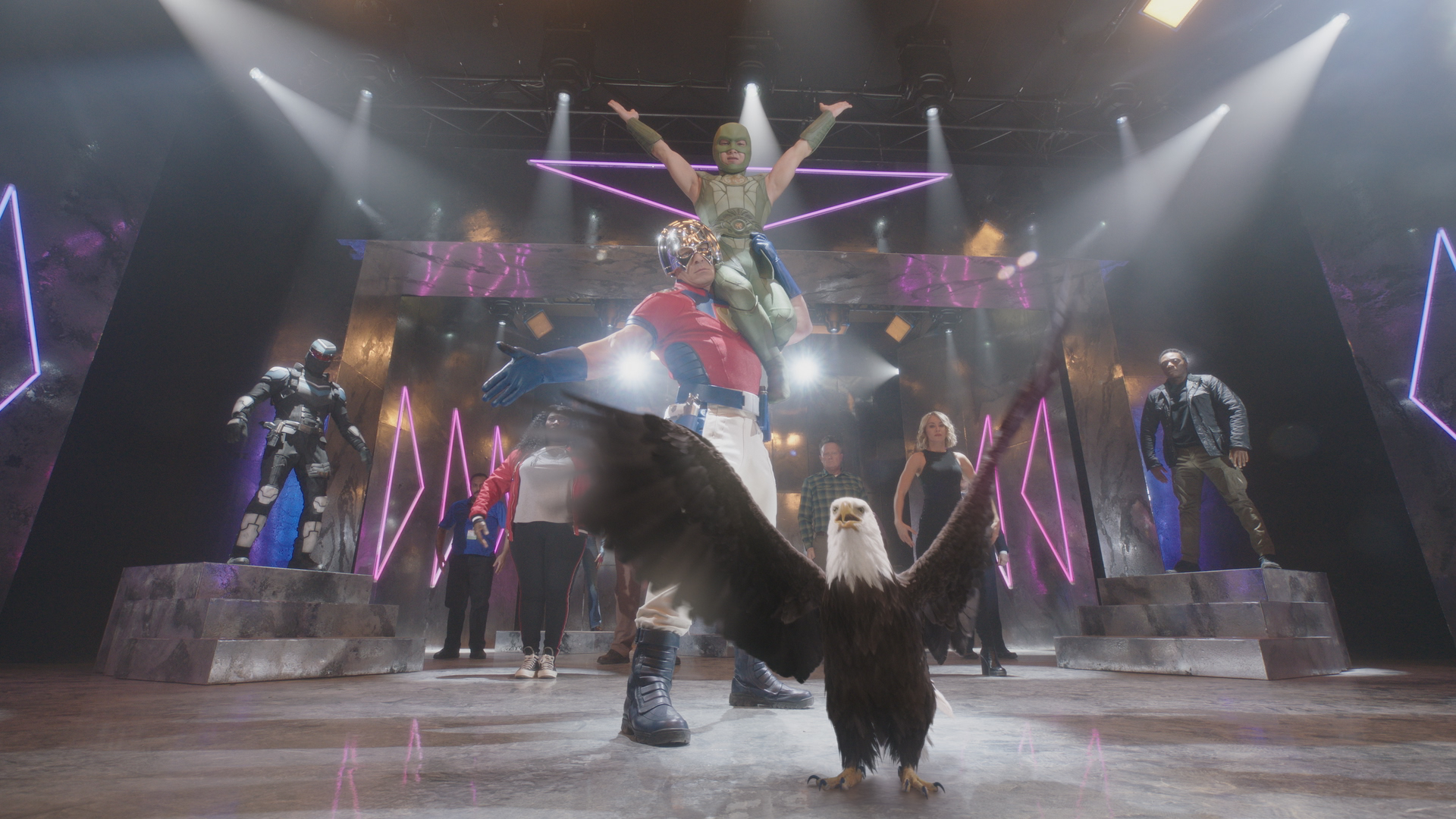 John Cena as Peacemaker, Jennifer Holland as Harcourt, Eagly and more pose in the Peacemaker opening title sequence