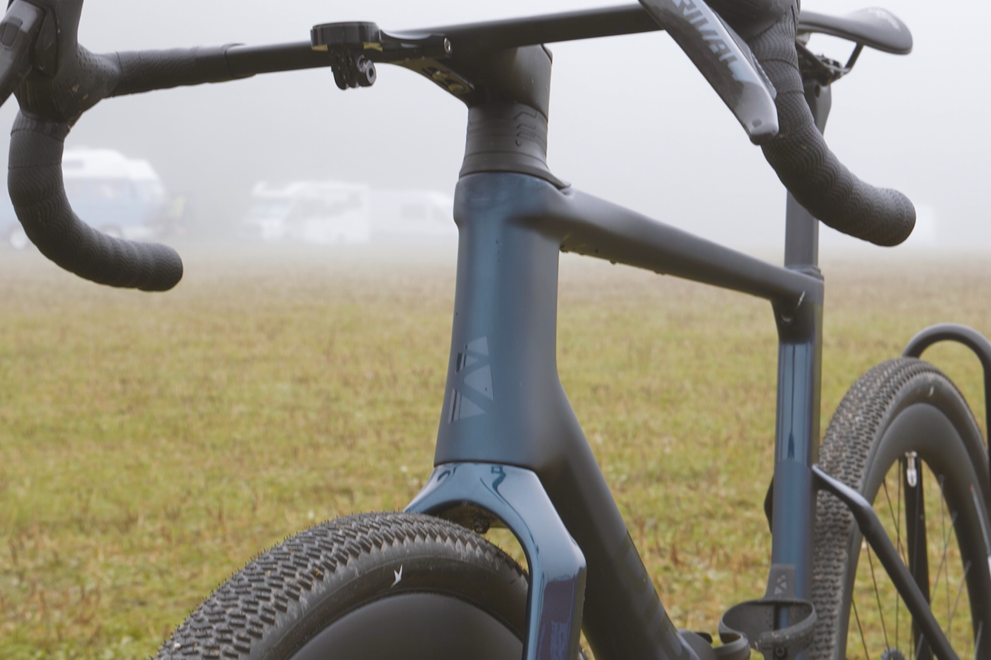 A blue Ribble gravel bike front end shot with integrated bar and stem