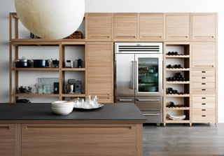 A wood kitchen with open shelving by Valcucine