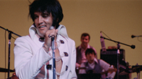 Elvis Presley wearing white jumpsuit in EPiC: Elvis Presley in Concert documentary for theaters and streaming in 2026