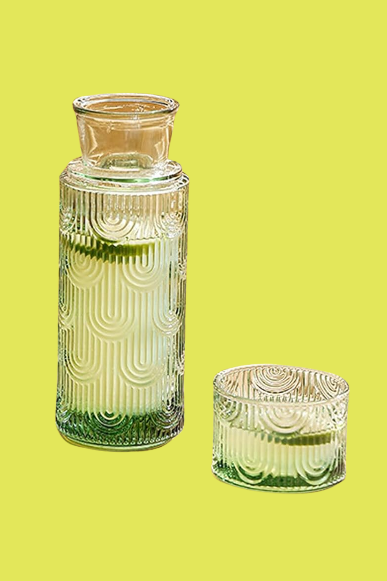 An art-deco style green glass carafe and cup