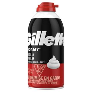 A stout black and red metal container of Gillette spray shaving foam