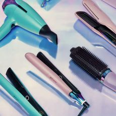 ghd hair straighteners, hairdryer and brush in pinks and teal blue