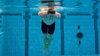 Chris Hemsworth tries to swim with his hands and feet tied during a Special Forces drown-proofing exercise.