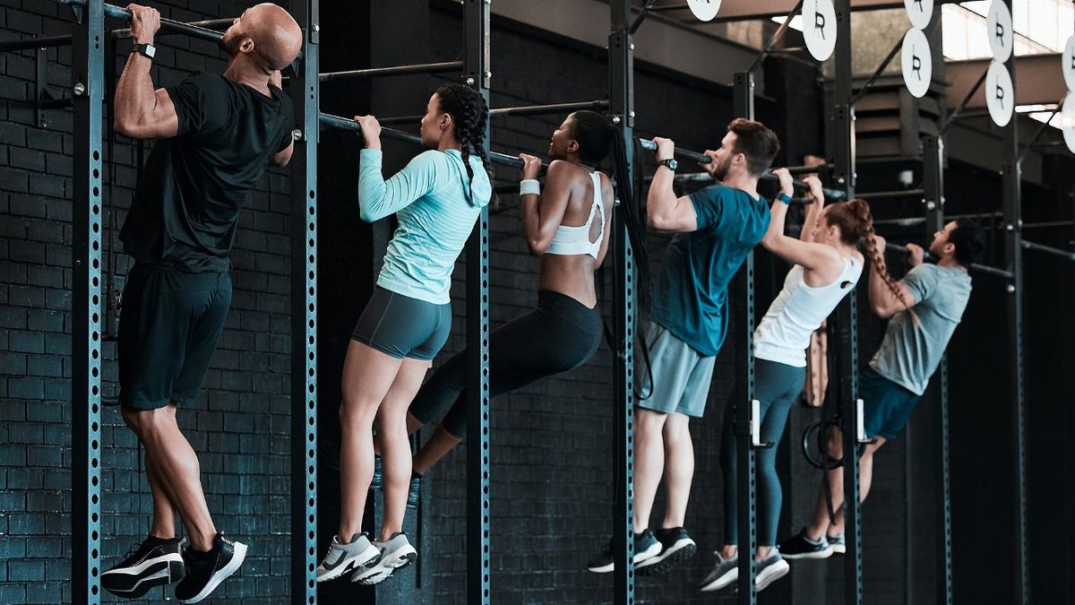 A group of people performing pull-ups, which feature in this back workout