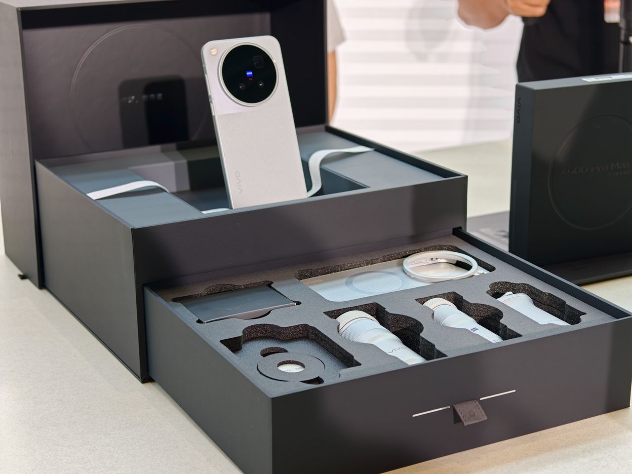 The Vivo X500 Pro Max phone complete photographer's kit, with telephoto converters, grip, additional cases and more, in black presentation box