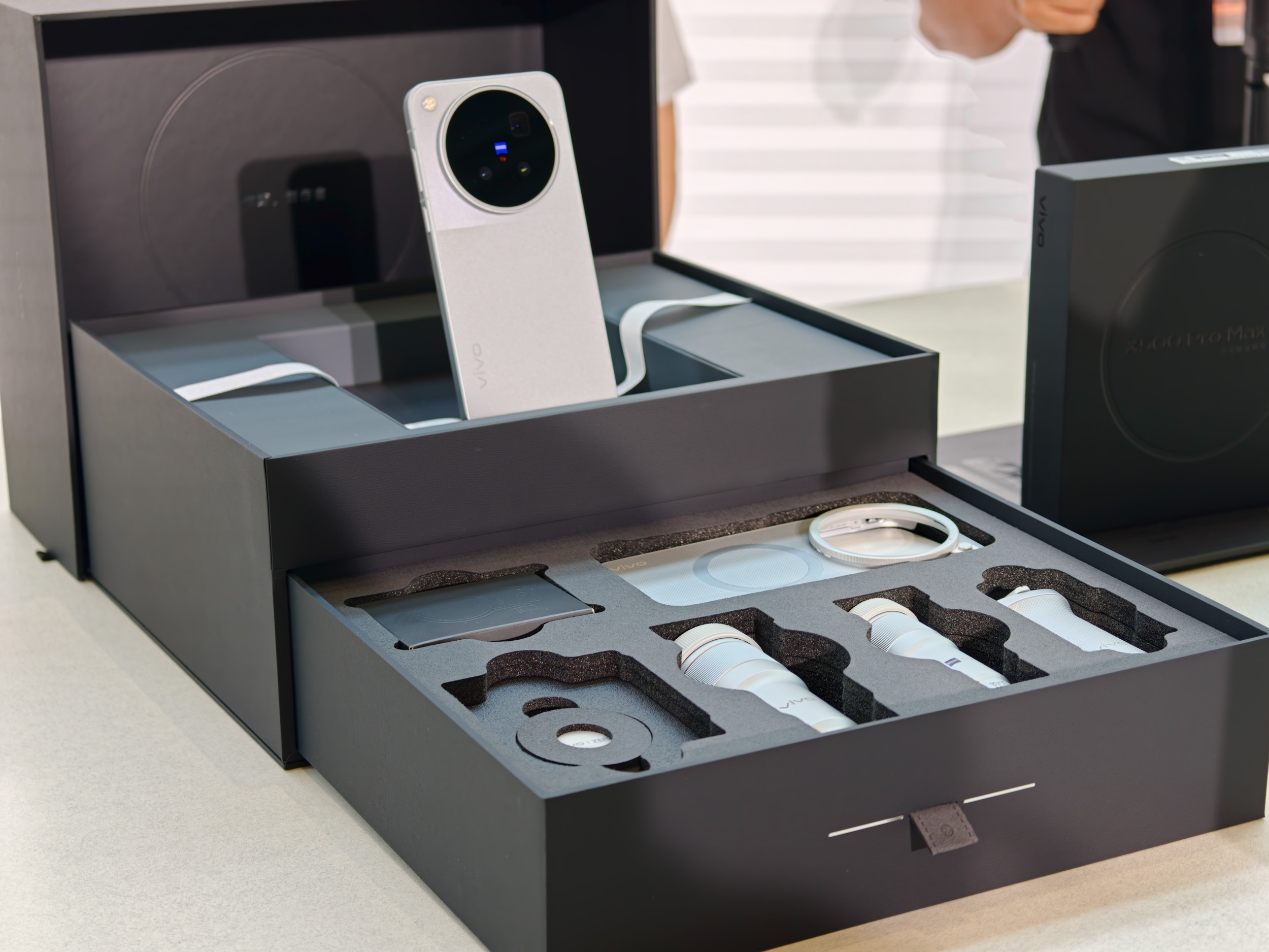 The Vivo X500 Pro Max phone complete photographer's kit, with telephoto converters, grip, additional cases and more, in black presentation box