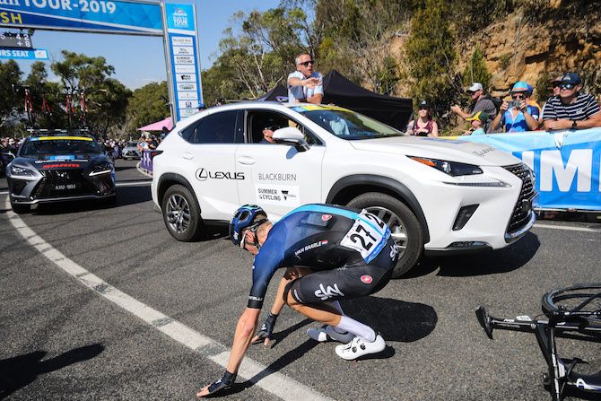 Dylan van Baarle drops his bike and then drops to the ground himself after a huge effort to successfully take the race lead