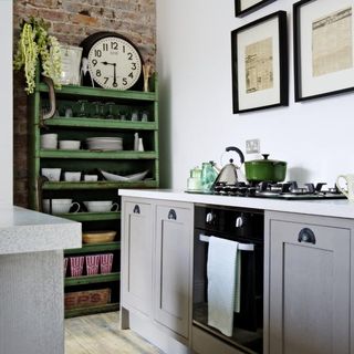 kitchen with white clock and open kitchen storage